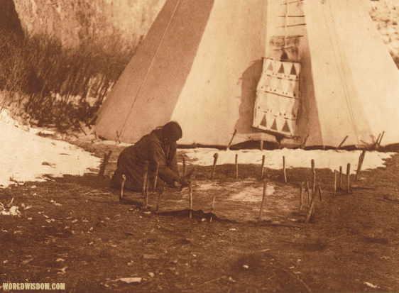 "Hide scraping" - Apsaroke, by Edward S. Curtis from The North American Indian Volume 4 