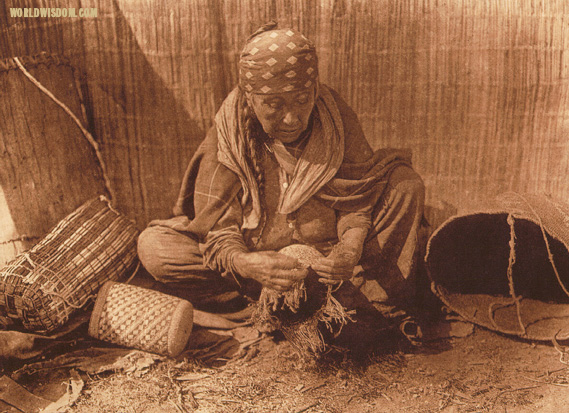 "Wishham basket worker", by Edward S. Curtis from The North American Indian Volume 8


