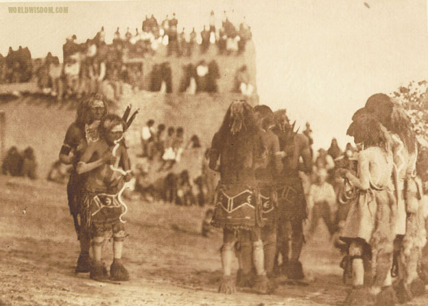 "Snake dancer and 'hugger' - Hopi", by Edward S. Curtis from The North American Indian Volume 12
