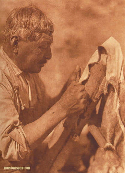 "Scraping a deerskin" - Washo, by Edward S. Curtis from The North American Indian Volume 15
